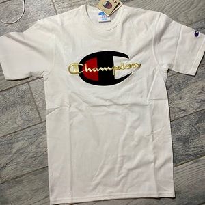 White Champion T-Shirt With Gold Writing.